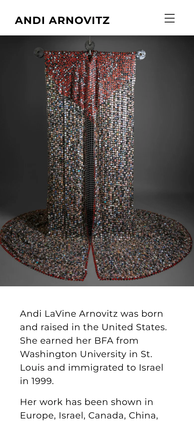 The mobile version of the homepage maintains the minimalist aesthetic but uses a condensed layout. The navigation menu is replaced by a hamburger icon, and the large hero image of the beaded garment is scaled to fit the vertical screen, followed by biographical text.