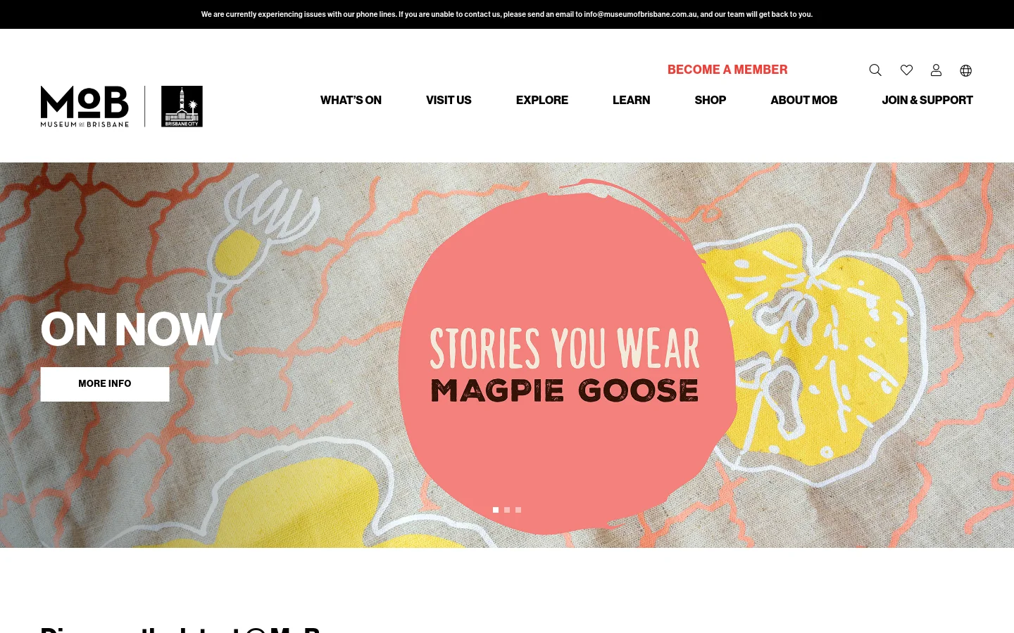 The Museum of Brisbane desktop homepage features a white header with the MoB logo, navigation links like 'What's On' and 'Visit Us', and a 'Become a Member' call to action. The hero section displays a large, colorful textile pattern background with a pink circular overlay reading 'ON NOW: STORIES YOU WEAR MAGPIE GOOSE' and a white 'MORE INFO' button.