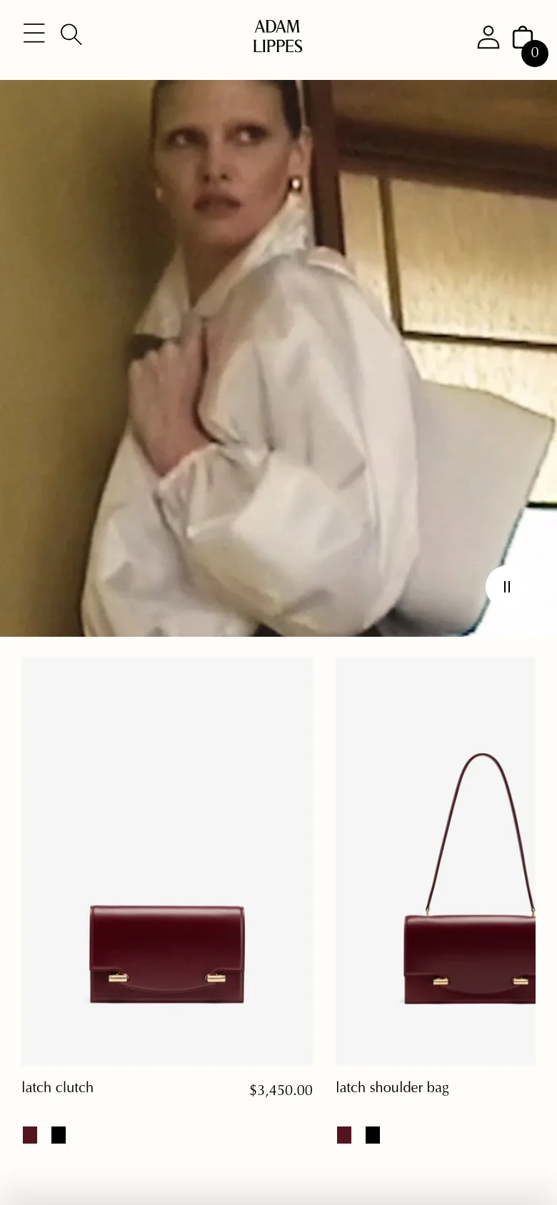 The mobile version uses a condensed header with a hamburger menu, search icon, and user profile icon, while the Adam Lippes logo remains centered. The hero video is scaled for a vertical aspect ratio, and the product grid shifts to a single-column layout, showing large images of the latch clutch and latch shoulder bag with prices listed below.