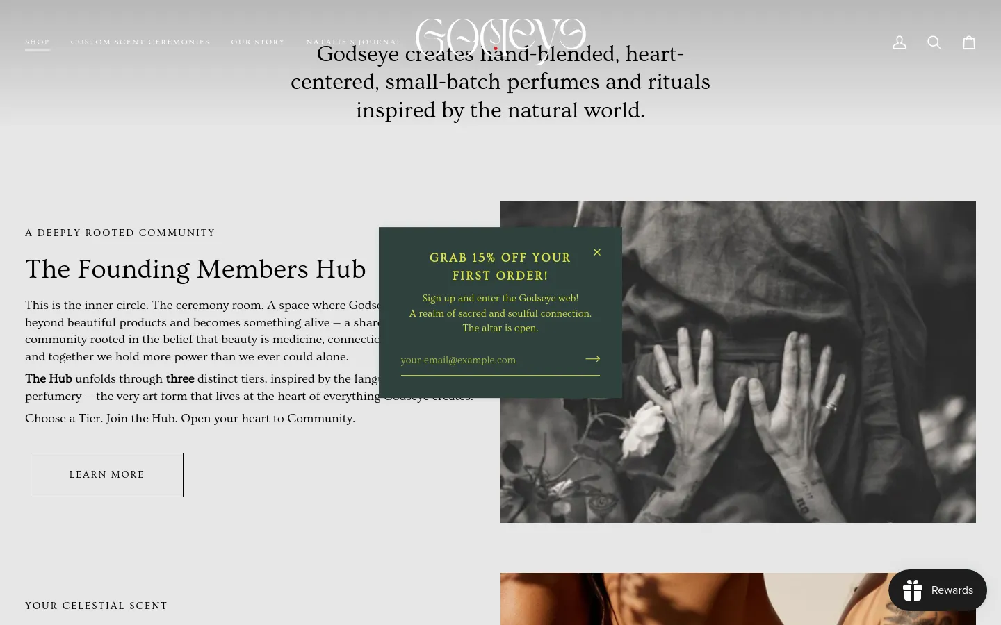 The desktop homepage features a minimalist design with a white header and dark serif typography. A large hero section shows a black and white photo of a person with a centered text overlay and a pop-up offering 15% off. Below, sections introduce 'The Founding Members Hub' and 'Big 3 Custom Perfume Oil' with large imagery and call-to-action buttons.