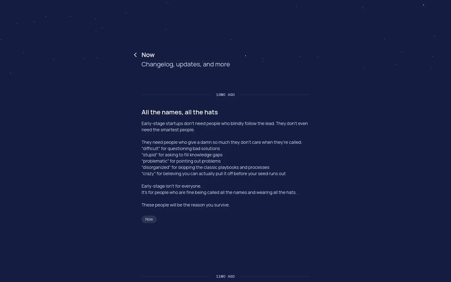 A minimalist desktop page with a dark navy background featuring subtle, scattered white dots. The layout is centered with a back link to 'Now', a large headline 'Now' followed by a subheadline 'Changelog, updates, and more', and a text-heavy section titled 'All the names, all the hats' describing early-stage startup culture.