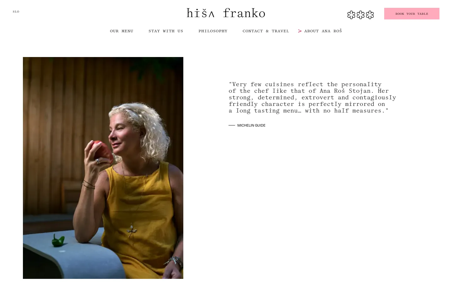 The desktop page features a minimalist design with a large hero image on the left showing chef Ana Roš in a yellow top, and a Michelin Guide quote on the right. The navigation menu is at the top, and the layout uses ample white space with elegant serif typography against a clean background.