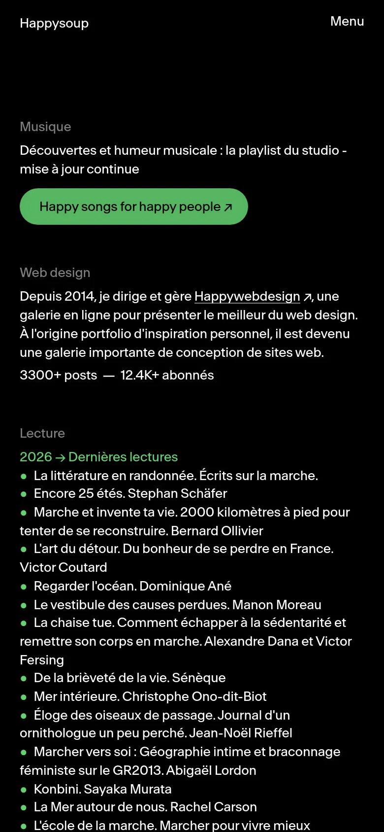 The mobile version maintains the dark theme and minimalist style but uses a vertical stack layout. The navigation is condensed into a 'Menu' button at the top right, and the text content is scaled for a single-column view on a narrow screen.