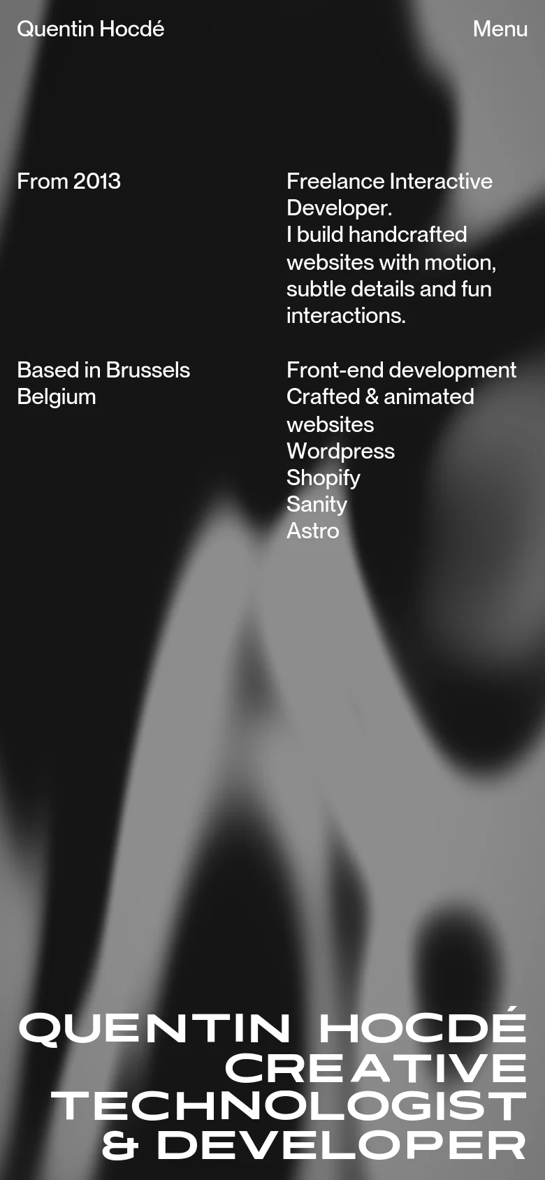 Quentin Hocdé mobile homepage with a vertically stacked layout. The large, bold white headline is positioned at the bottom, while the hero text and service details are reflowed into a single column against a dark, blurred abstract background.
