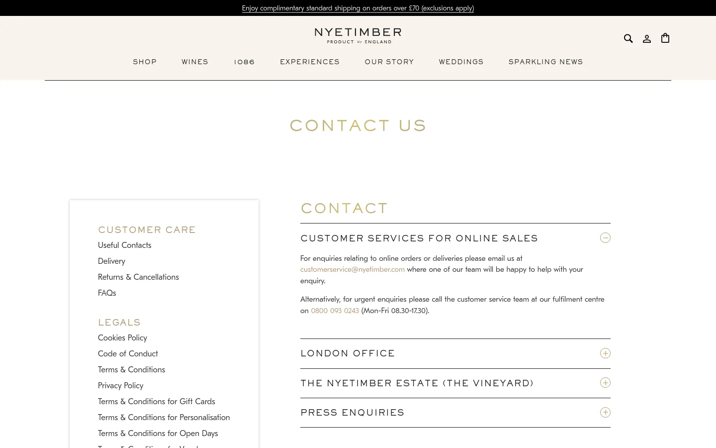 The desktop Contact Us page features a minimalist design with a white background and gold-toned text. A sidebar on the left contains navigation links for Customer Care and Legals, while the main right-side area uses an accordion-style layout to organize contact information for Customer Services, the London Office, the Vineyard, and Press Enquiries.