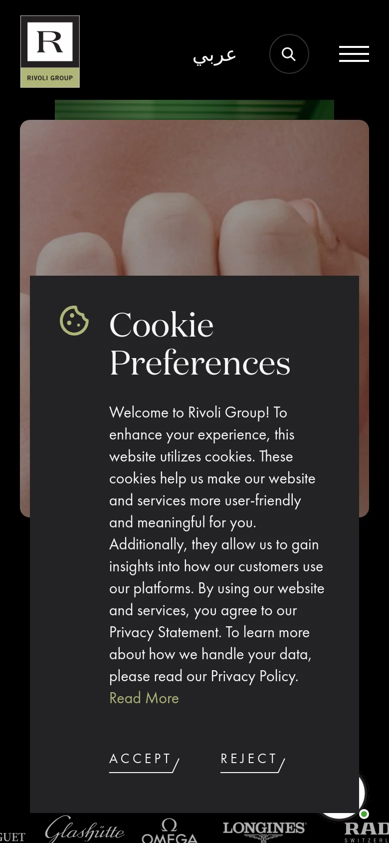 The mobile version presents a condensed layout with a hamburger menu and search icon at the top. The hero image of gemstone rings remains prominent, but the statistical text is overlaid or repositioned. A large, centered cookie preference modal dominates the foreground, obscuring much of the content.