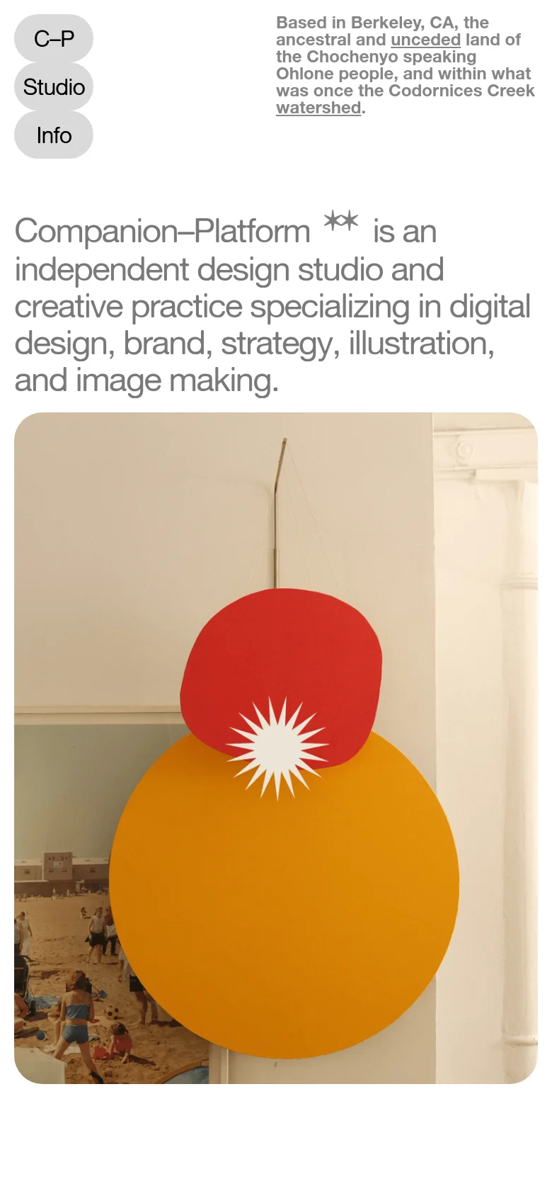 The mobile version maintains the minimalist aesthetic but uses a vertical layout. The navigation buttons are stacked on the left, and the location text is moved above the main headline. The large hero image of the red and yellow circular art installation occupies the bottom half of the screen.