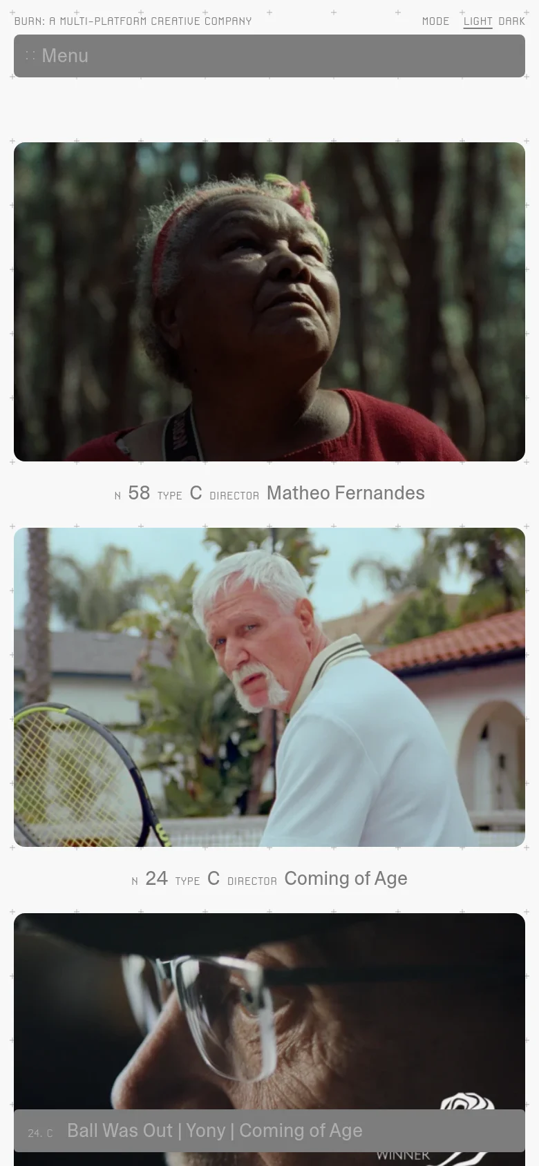 The mobile version presents the portfolio as a single-column vertical list of large, full-width project images. Each image is followed by its corresponding project details, such as number and director, creating a streamlined scrolling experience compared to the desktop grid.
