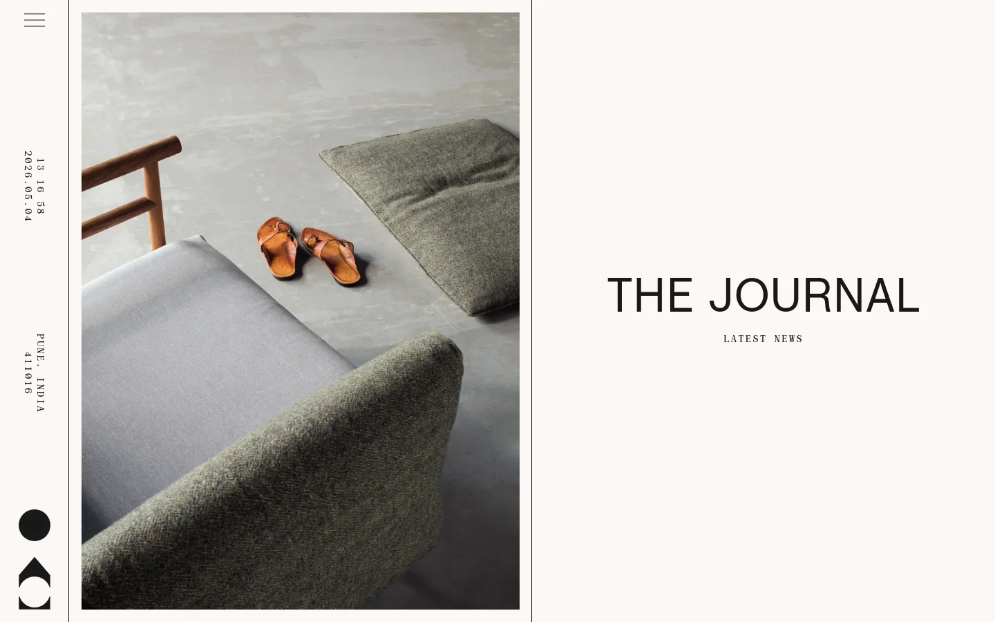 The desktop Journal page features a minimalist design with a large hero image on the left showing a gray sofa and brown sandals on a concrete floor. To the right, the large headline 'THE JOURNAL' is displayed above the subheadline 'LATEST NEWS' against an off-white background. A vertical sidebar on the far left contains the date and location in small text.