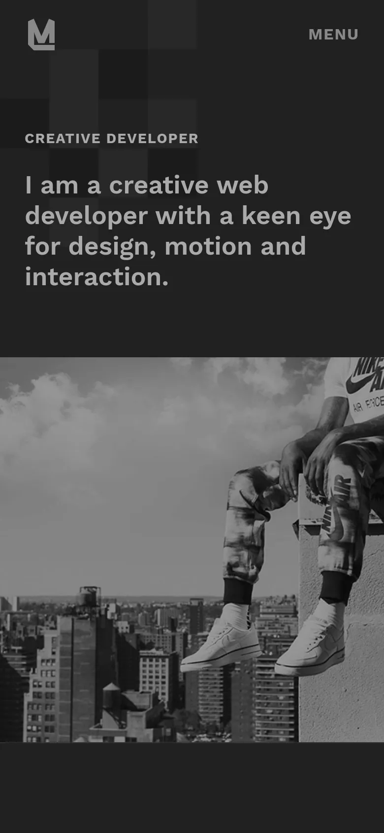 The mobile version maintains the dark theme and large headline but simplifies the layout. The top navigation is replaced by a single 'MENU' text link next to the brand logo, and the hero image of the person overlooking the city is scaled to fit the vertical screen.