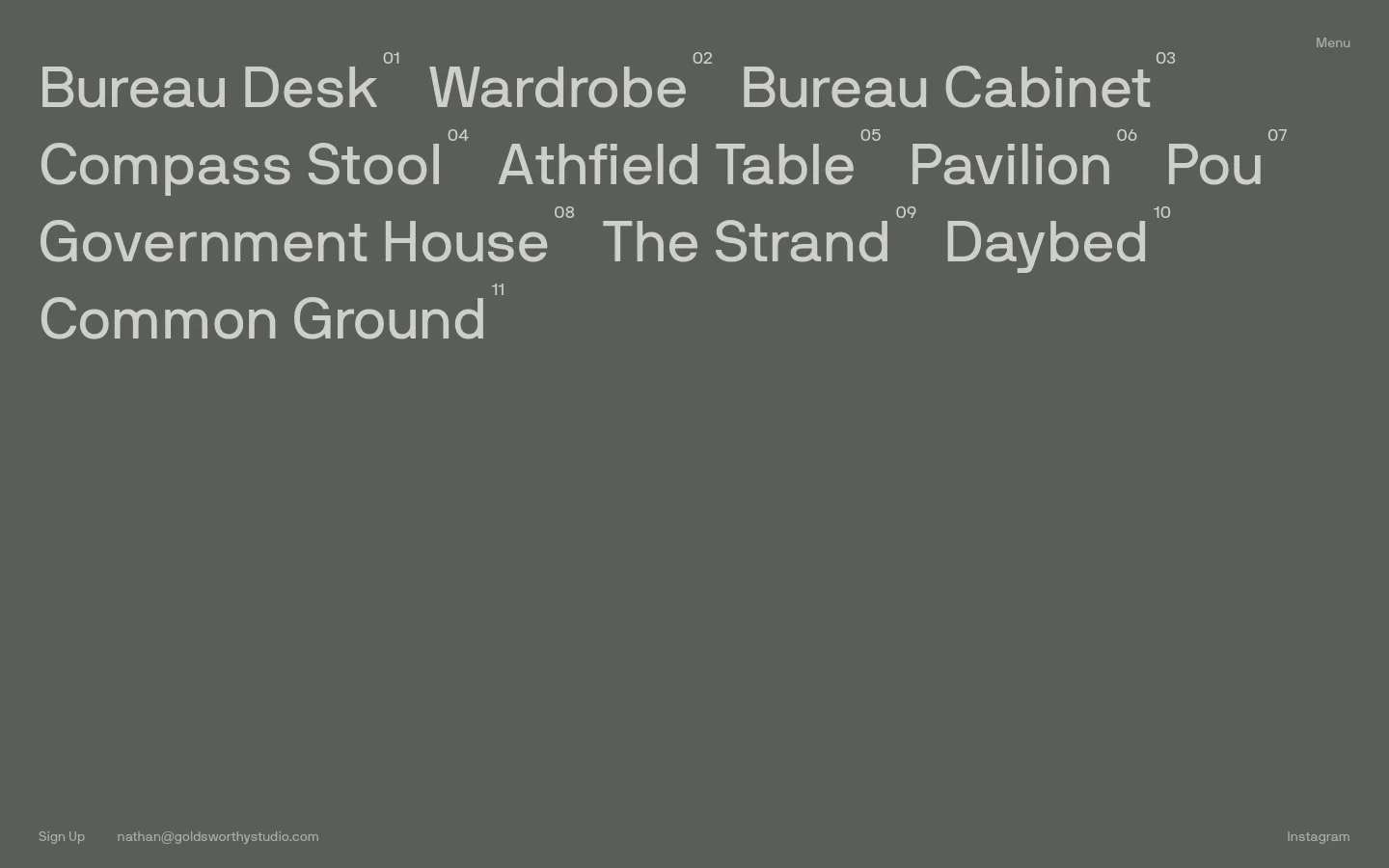 The desktop page features a minimalist dark gray background with large, white sans-serif text listing various furniture pieces like Bureau Desk, Wardrobe, and Bureau Cabinet. Each item is accompanied by a small sequential number, and a navigation menu is located in the top right corner. Contact information and social links are positioned at the bottom of the screen.