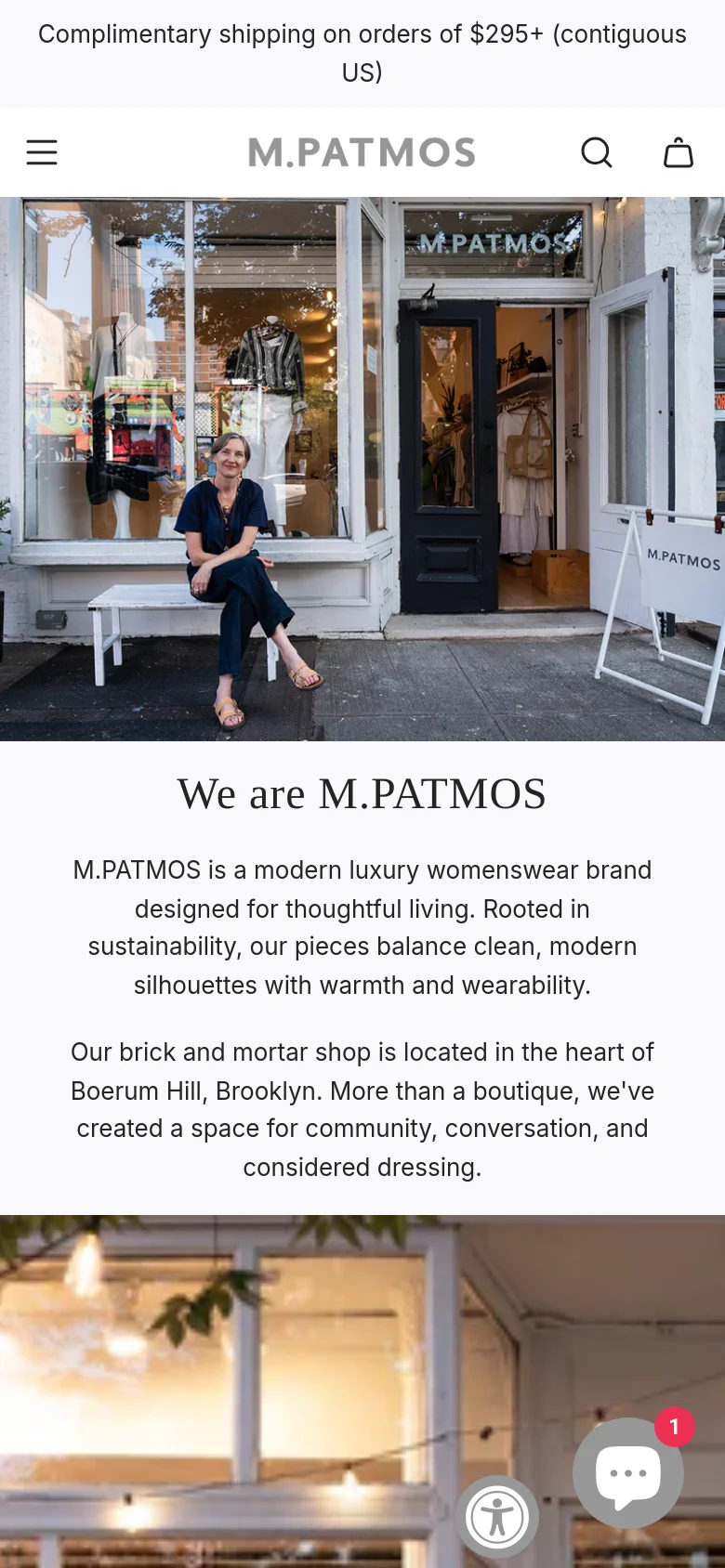 The mobile version uses a single-column vertical layout. The large storefront photograph is positioned at the top, followed by the 'We are M.PATMOS' headline and brand description text on a white background. The navigation is condensed into a hamburger menu and search icon at the top, and accessibility widgets appear as floating circular icons at the bottom right.
