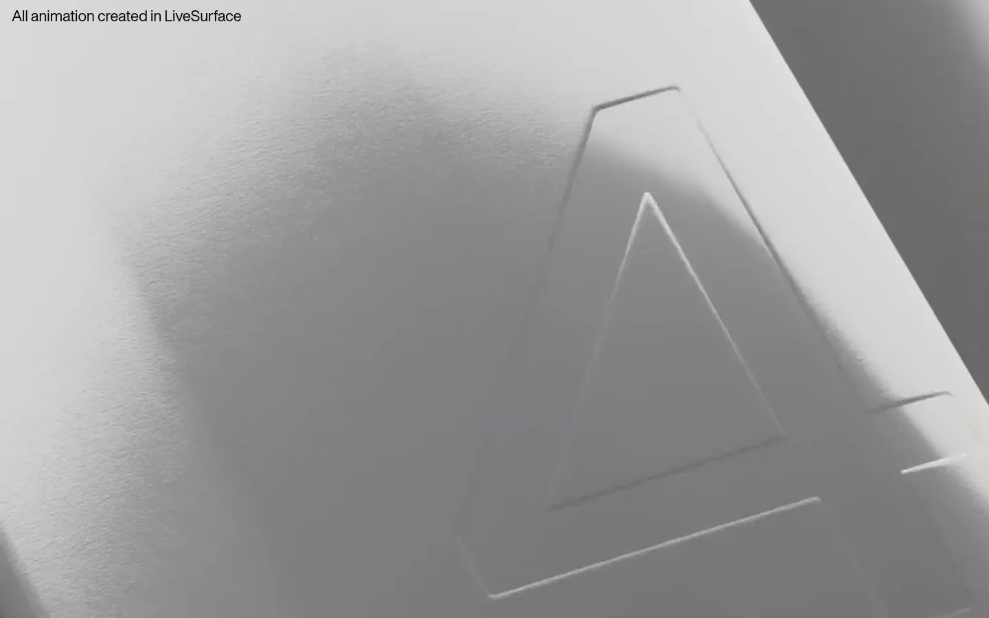 The desktop homepage features a dark, minimalist design with large white typography. A hero section displays a high-quality close-up video of embossed textures, followed by sections detailing features like 'Curated surfaces' and 'Plus Surfaces' with wide UI screenshots and product imagery. The layout uses a clean, vertical scroll with ample whitespace and high-contrast text.