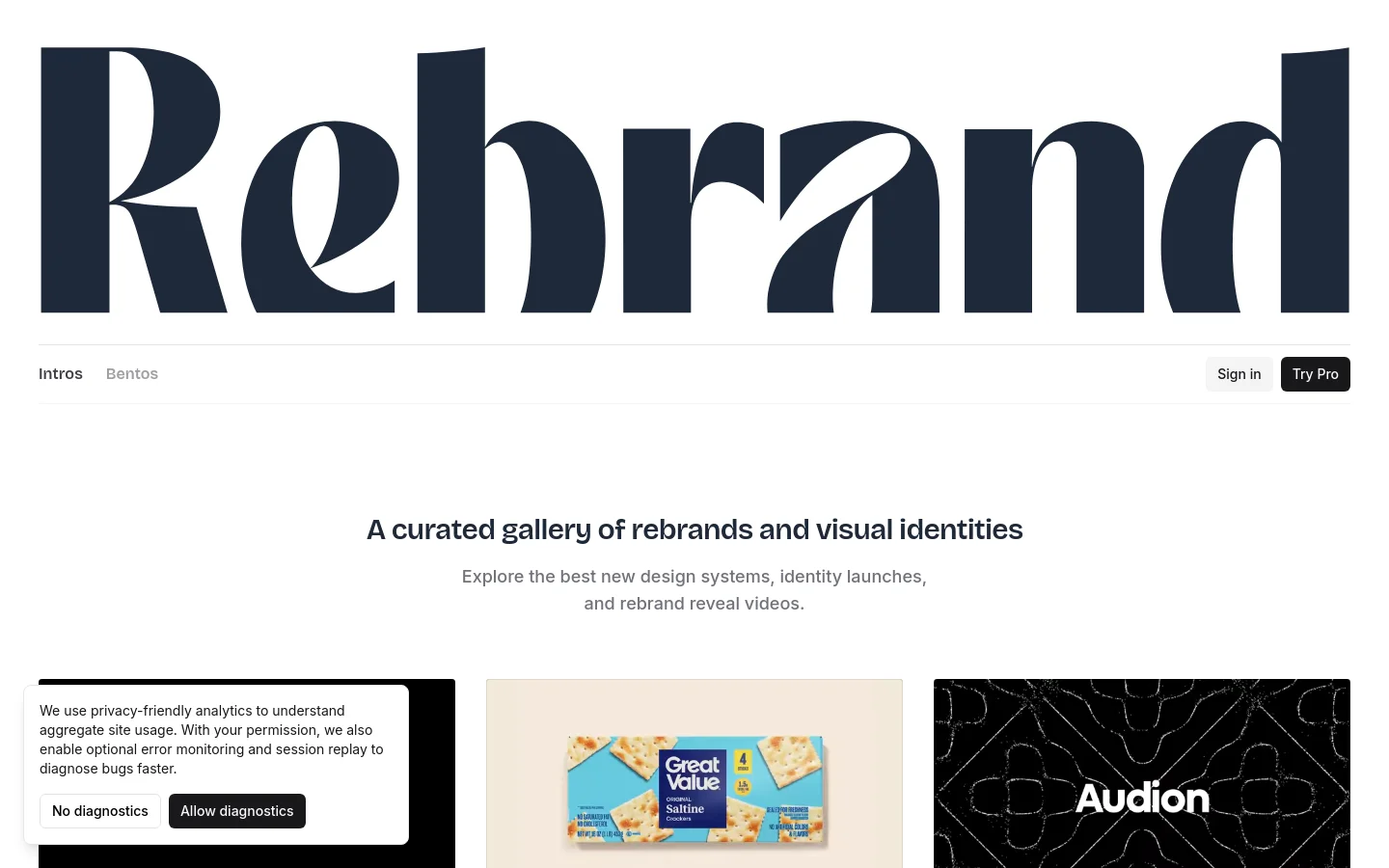 The desktop homepage features a large, stylized dark navy 'Rebrand' logo at the top, followed by a navigation bar with 'Intros', 'Bentos', 'Sign in', and 'Try Pro' buttons. The hero section displays the headline 'A curated gallery of rebrands and visual identities' in a bold sans-serif font against a white background. Below the text, a grid of brand identity cards begins, showcasing logos and names like Magnific and Walmart.