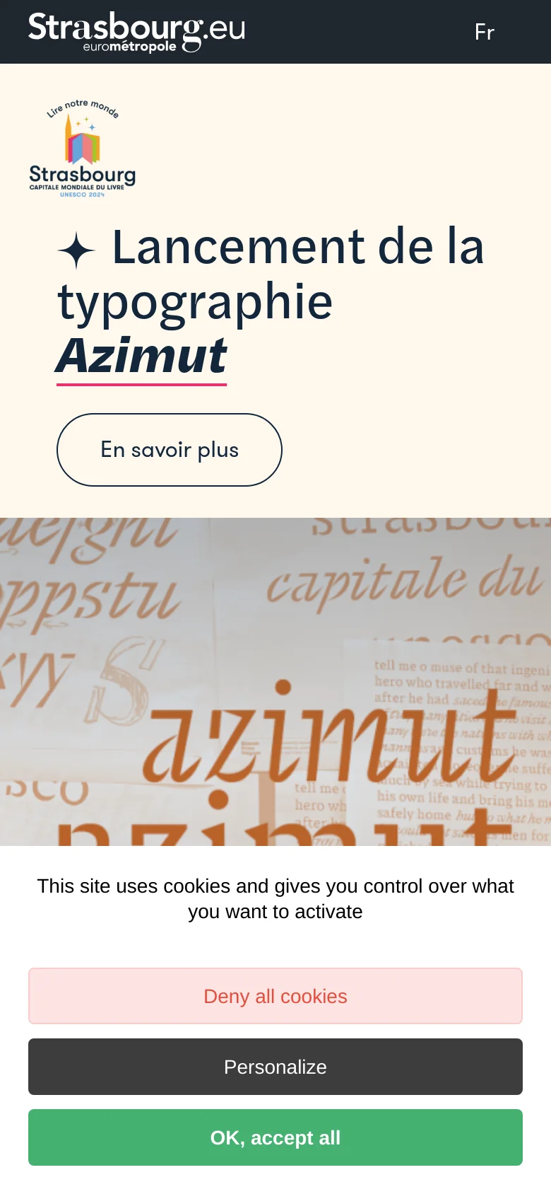 The mobile version presents a vertically stacked layout starting with the Strasbourg logo and the headline 'Lancement de la typographie Azimut' on a cream background. Below the headline is a prominent 'En savoir plus' button, followed by a large background image featuring stylized typography. A cookie consent banner occupies the bottom of the screen with three distinct buttons.