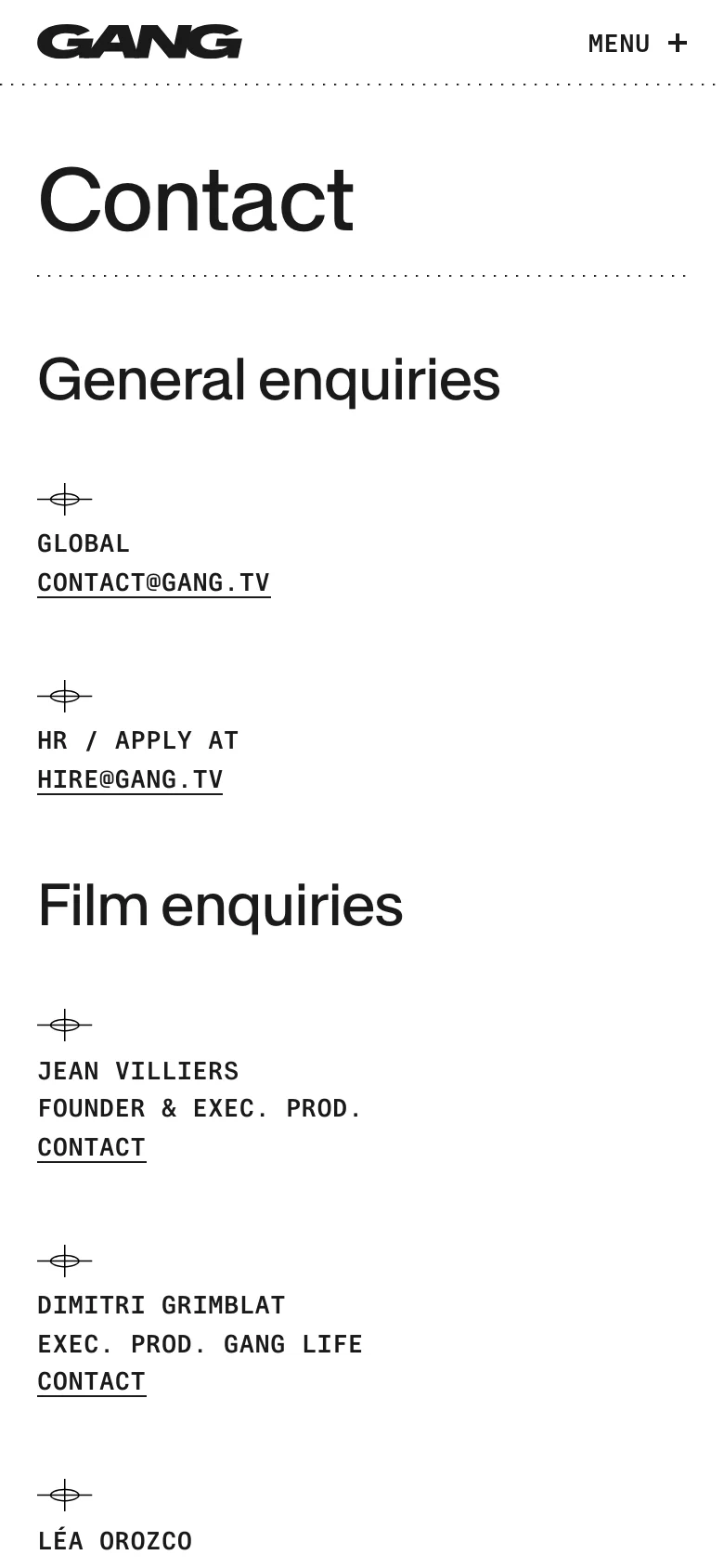 The mobile version maintains the minimalist white and black aesthetic but uses a single-column vertical layout for all text. The navigation is condensed into a 'MENU' button with a plus icon at the top right, and the contact information is stacked vertically for easier scrolling.