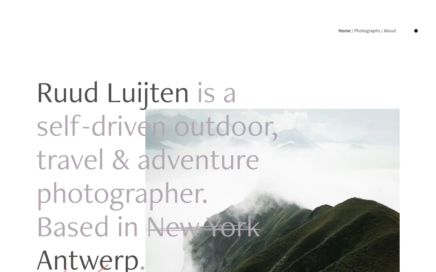 The desktop homepage features a minimalist white layout with large, dark grey typography overlaying a hero image of a misty mountain ridge. Navigation links for Home, Photographs, and About are positioned in the top right, and the text introduces Ruud Luijten as an outdoor and adventure photographer.