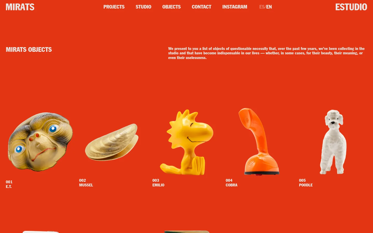 A desktop webpage with a vibrant red background featuring the headline 'MIRATS OBJECTS' and a descriptive paragraph. Below, a horizontal row of five eclectic objects is displayed: an E.T. mask, a mussel shell, a yellow Emilio figure, an orange Cobra joystick, and a white poodle. The navigation menu at the top includes links for Projects, Studio, Objects, Contact, Instagram, and language selection.