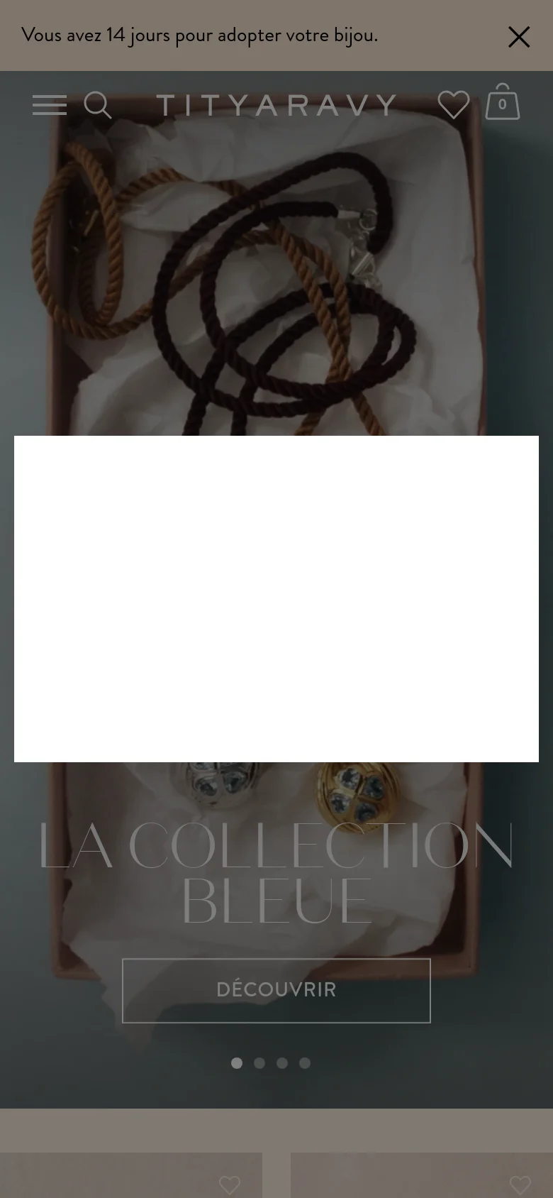 The mobile version displays a vertically oriented hero image of the jewelry collection with the text 'LA COLLECTION BLEUE' and a 'DÉCOUVRIR' button overlaid at the bottom. The header is condensed, featuring a hamburger menu icon, a search icon, the brand name, a heart icon, and a shopping bag icon.