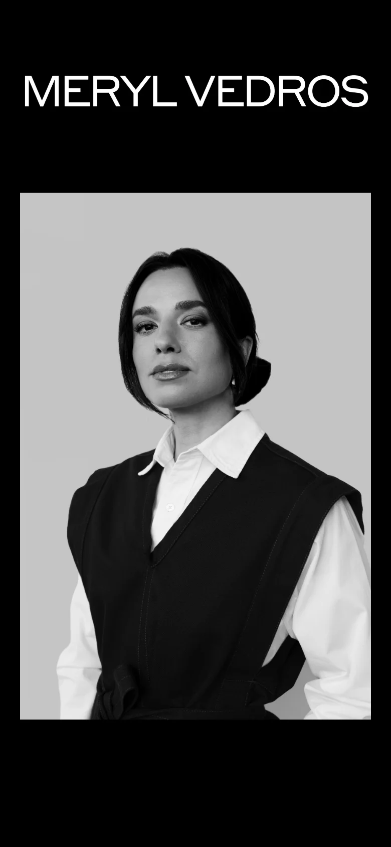 The mobile version maintains the high-contrast black and white theme, featuring the large 'MERYL VEDROS' headline at the top. The black-and-white portrait is repositioned to fill more of the vertical screen space, creating a stacked, portrait-oriented composition.